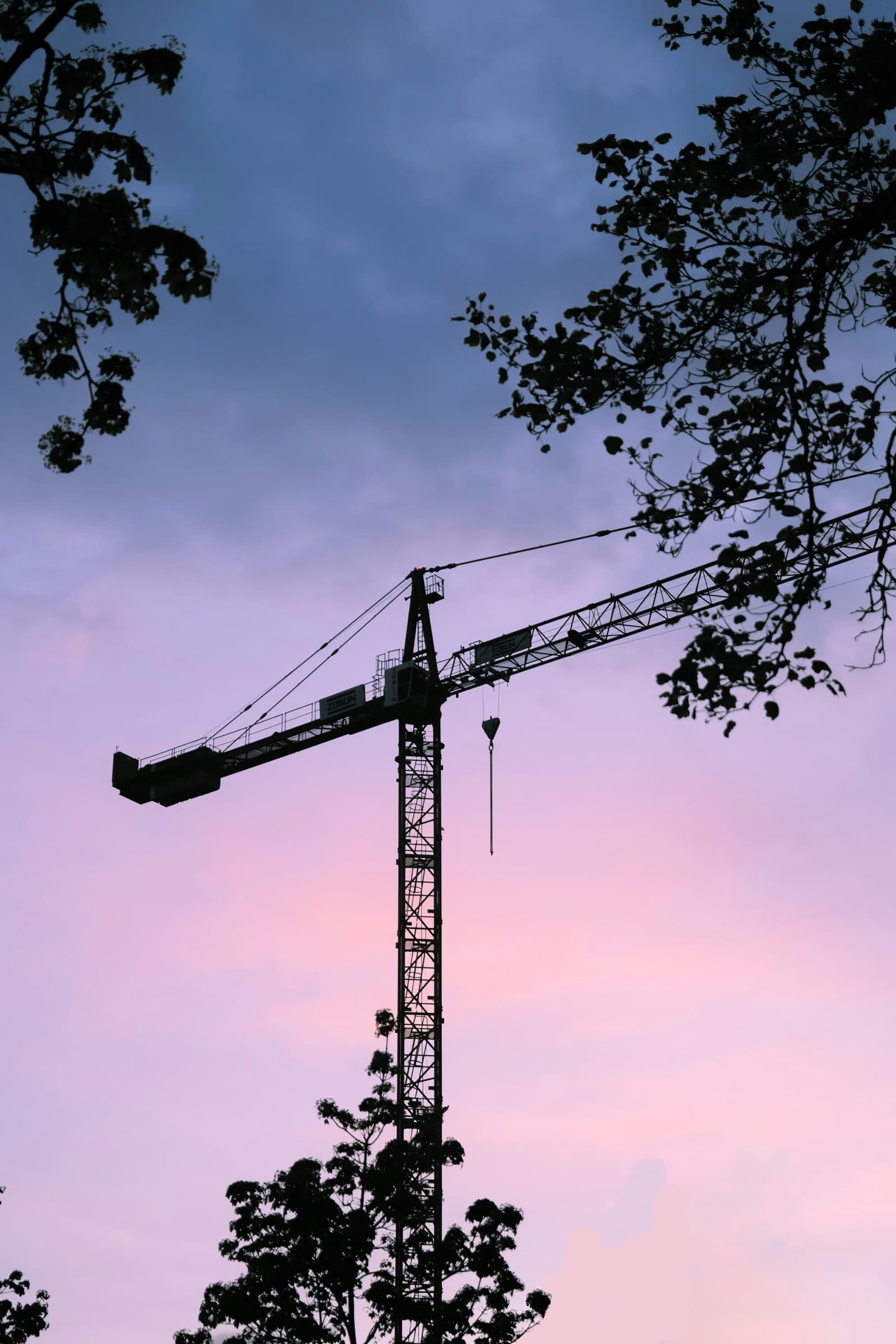Security officer monitoring a construction site at dusk
